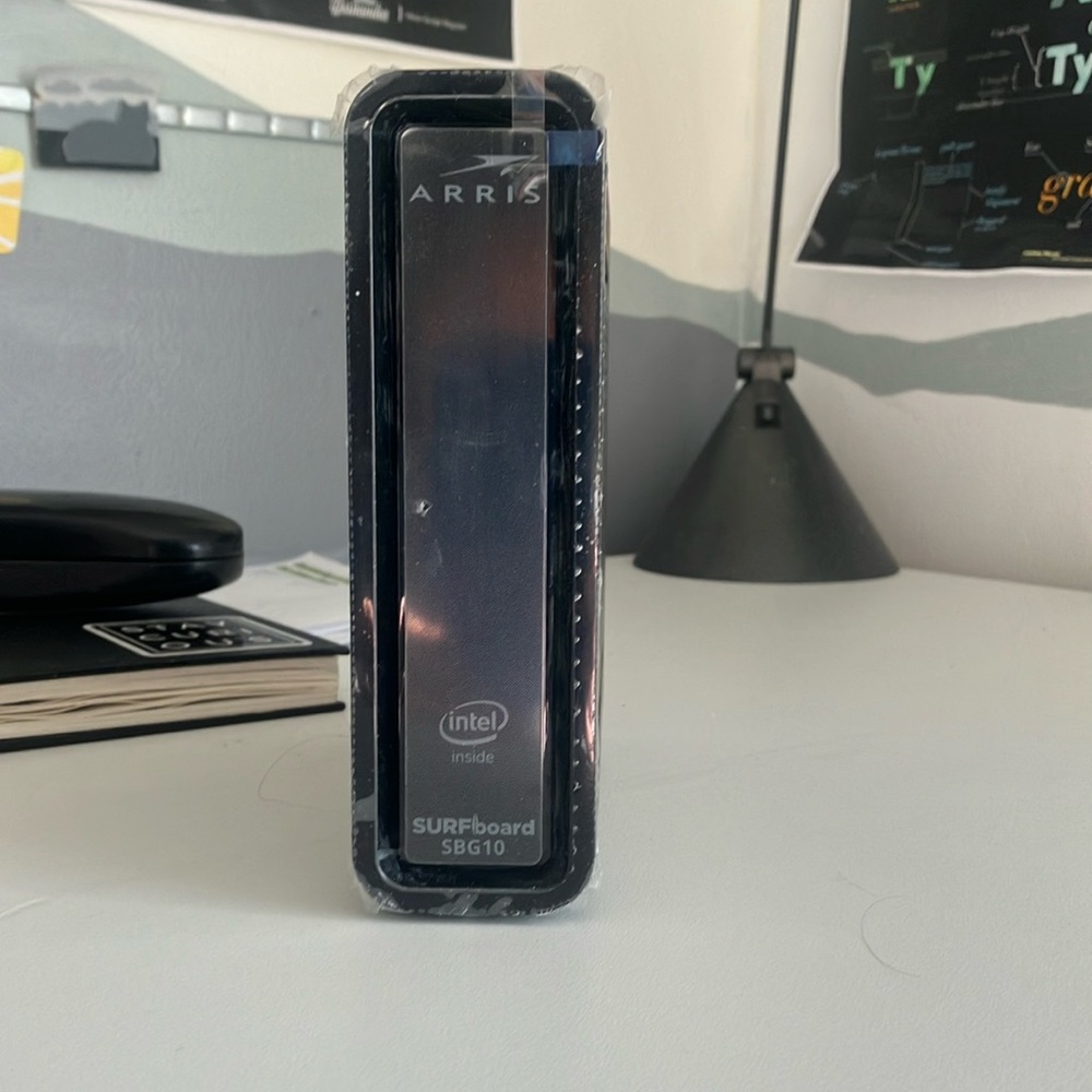 Arris surfboard SBG 10 combined modem and router. Two years old, purchased new.